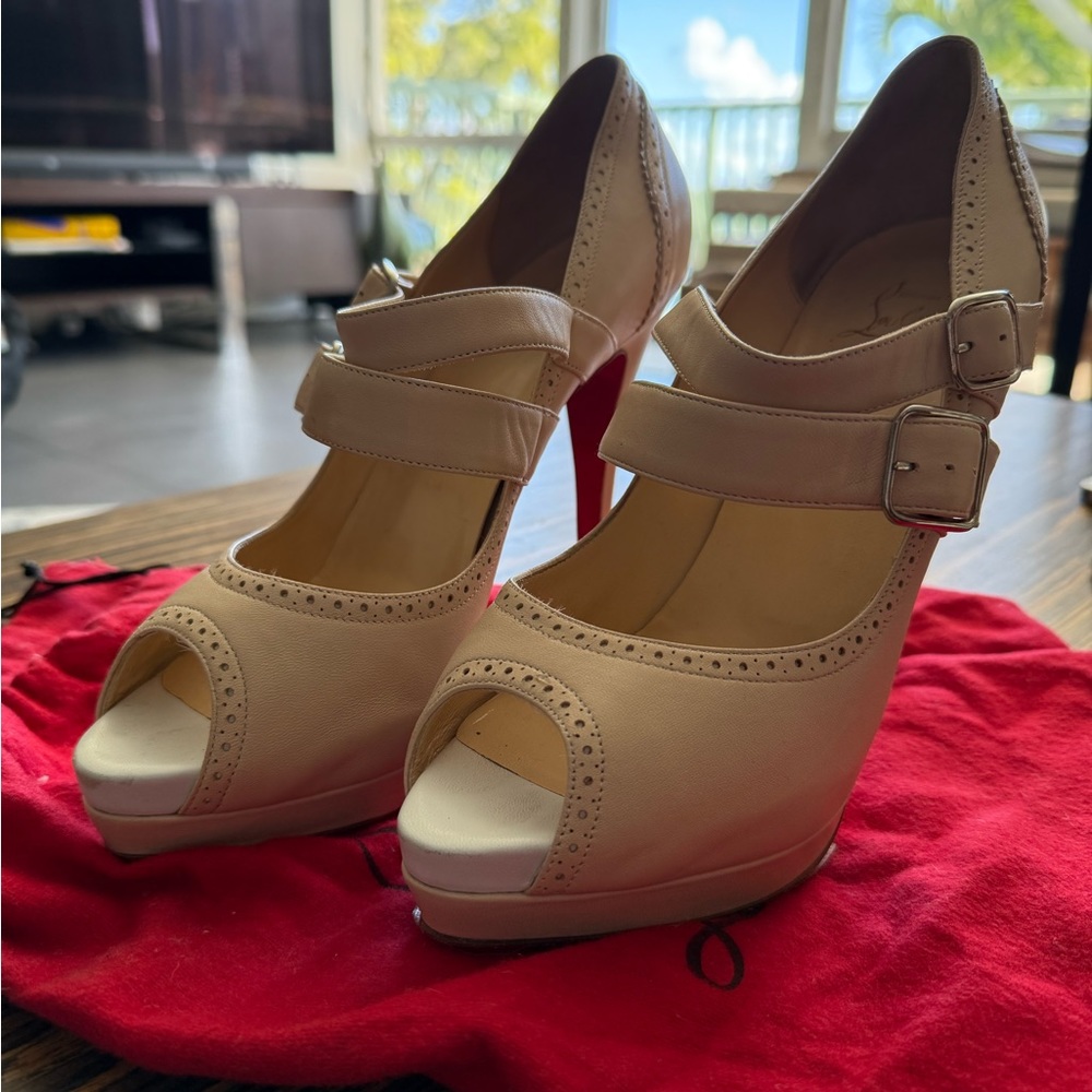 Christian Loubouton peeptoe Mary Jane’s with double straps.